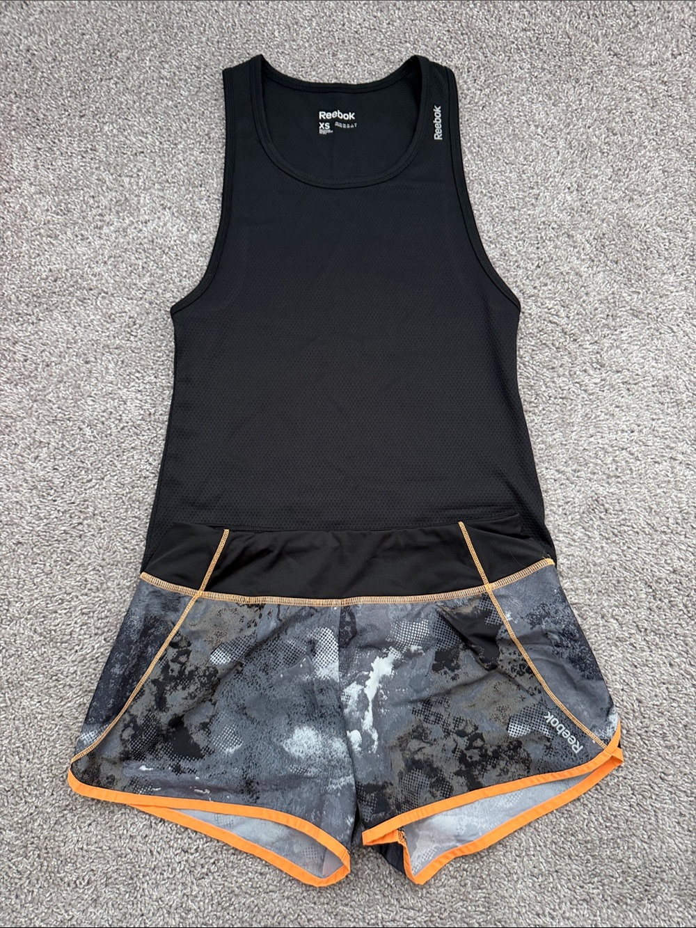 Reebok Speedwick Black Tank with Gray Camo Shorts and Orange Trim
